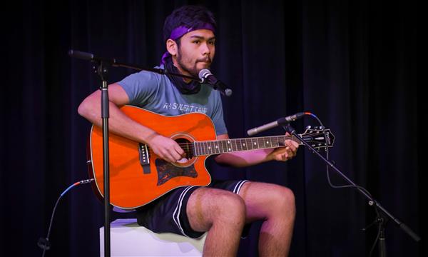 boy plays guitar